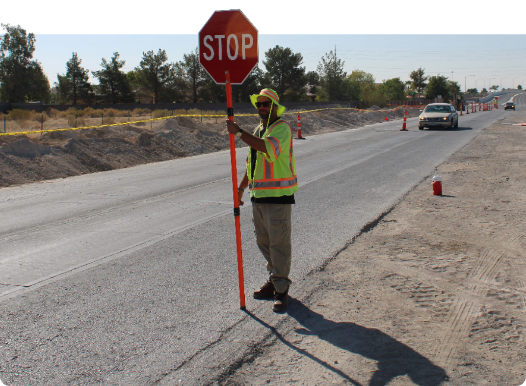 Traffic control worker holding stop sign