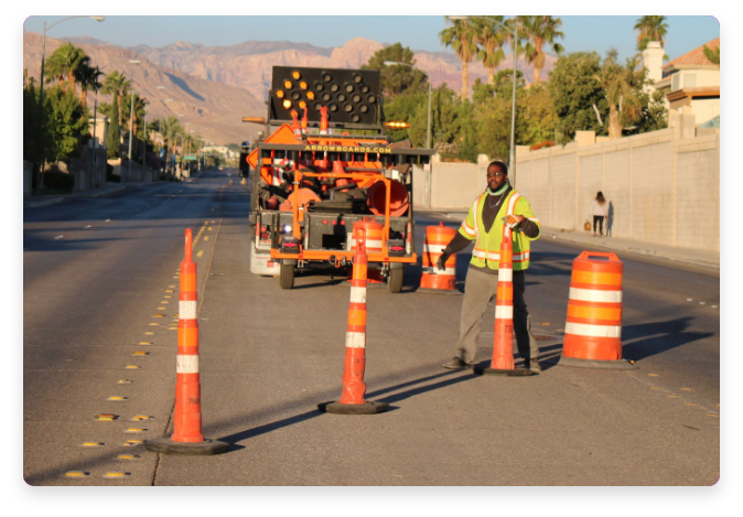Man setting traffic cones for roadwork