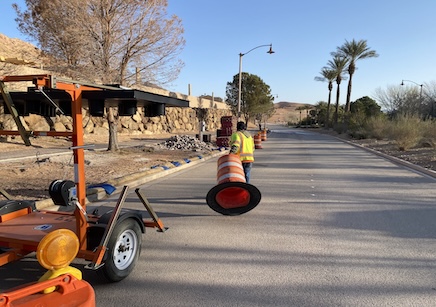 Worker setting up traffic control